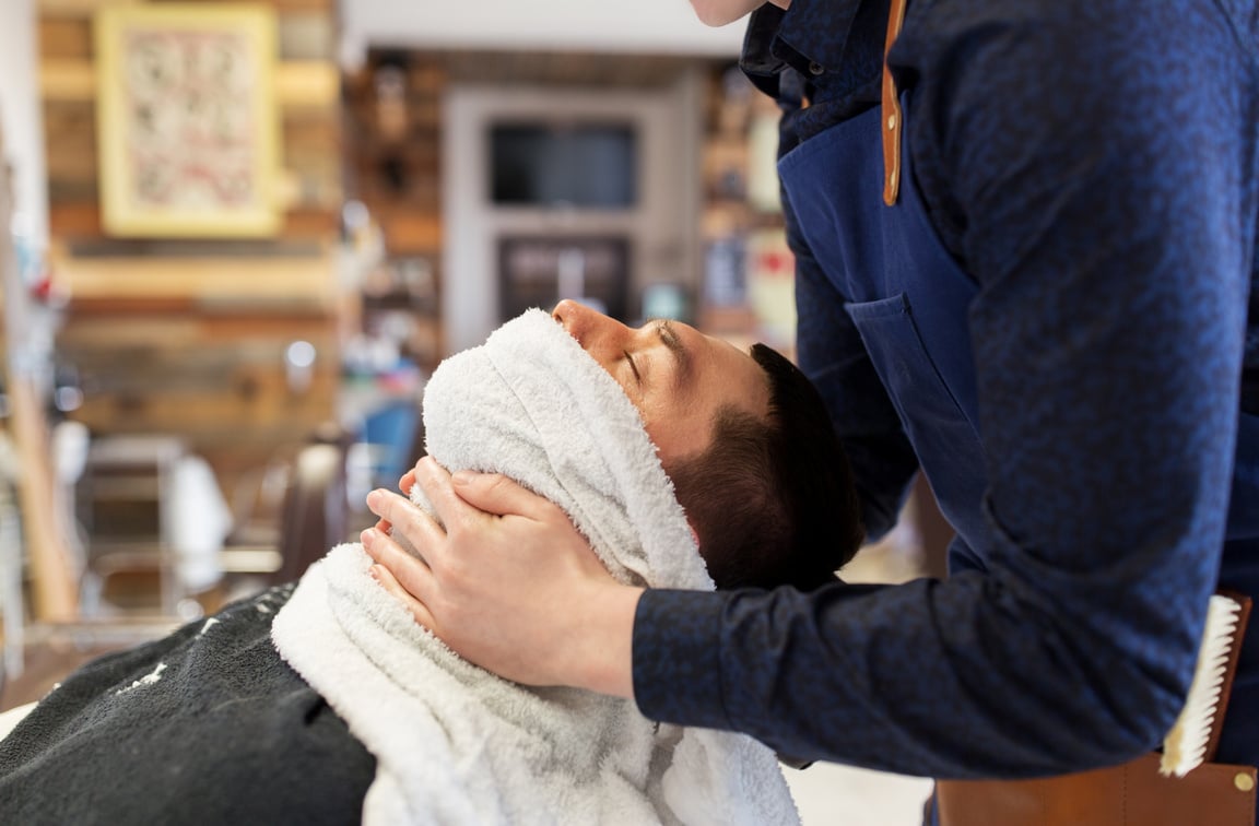 Barber Softening Male Face with Hot Towel