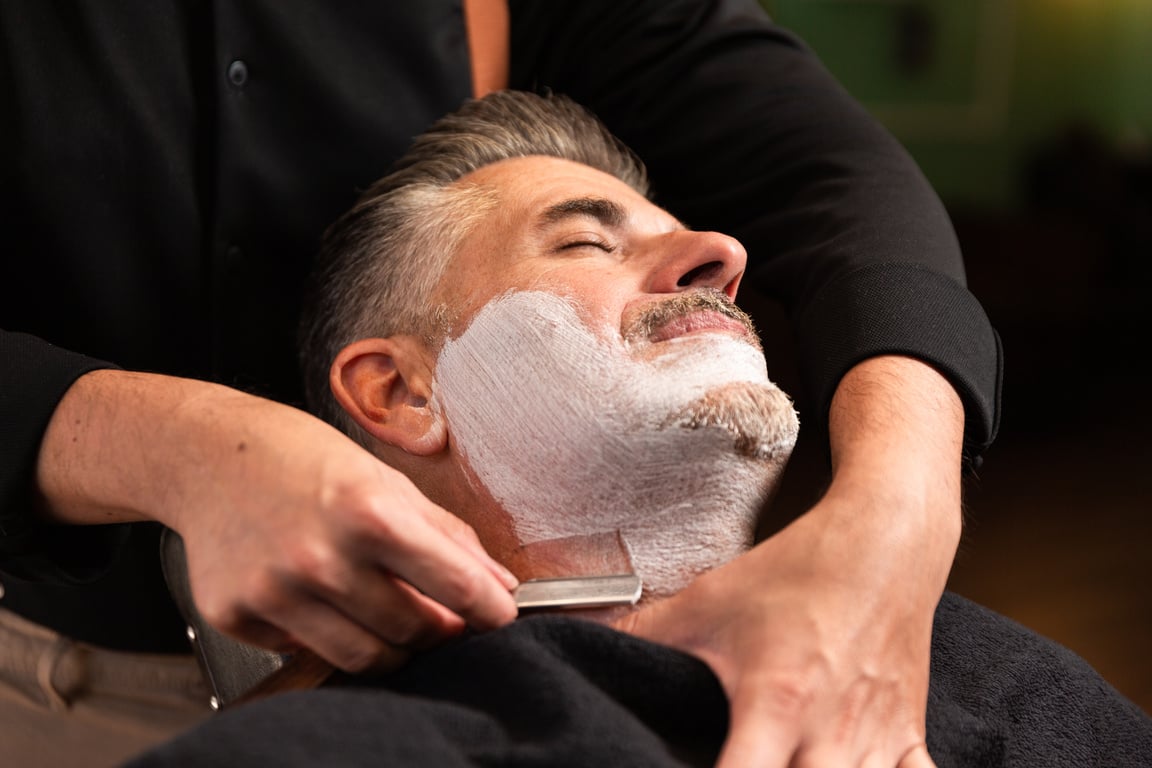 Barber Shaving a Client's Beard 